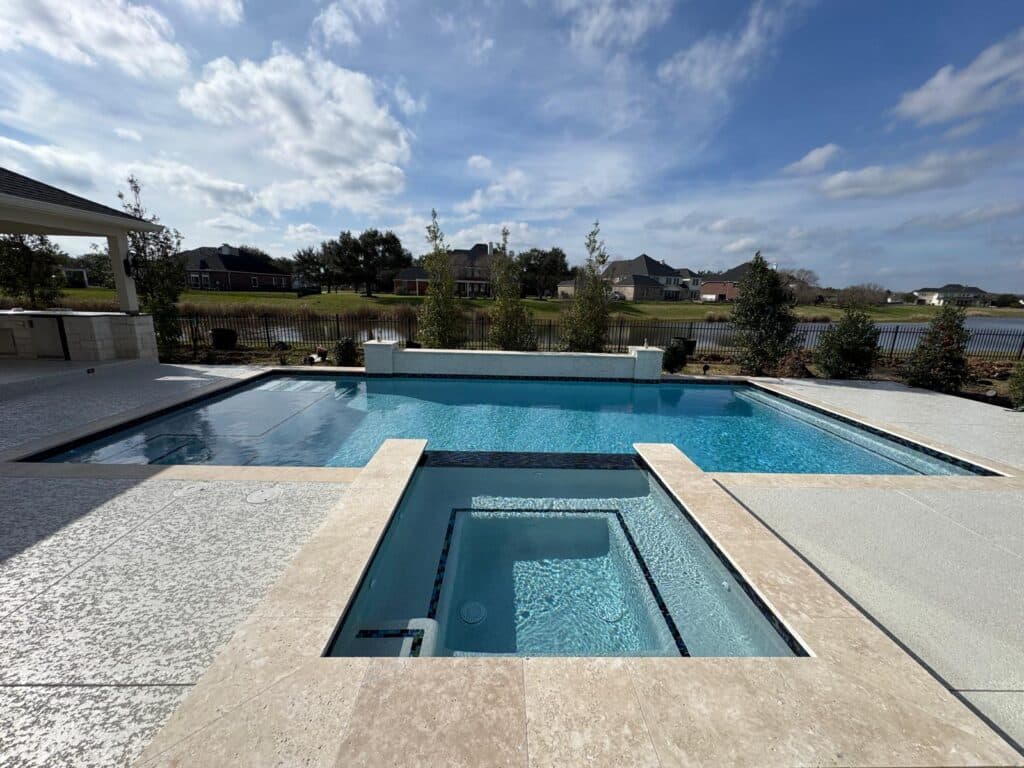 Pool with wide tanning ledge and open view
