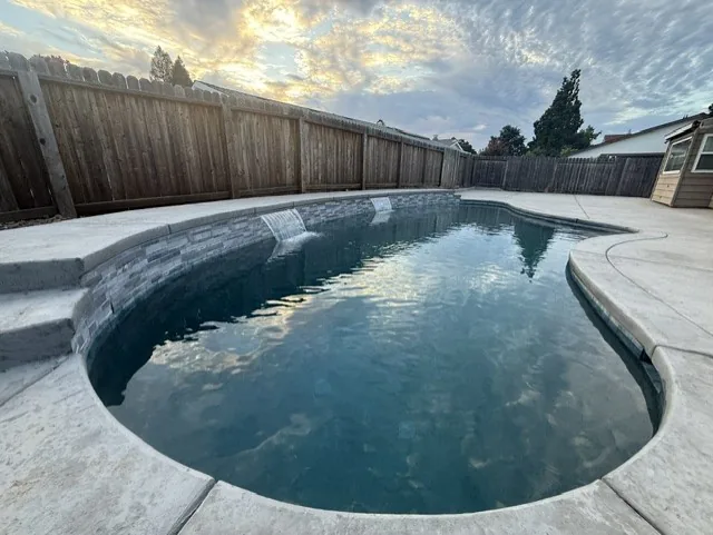 Rancho Cordova project β Freeform pool broom finish deck by Pinnacle Pools and Landscape, Sacramento CA