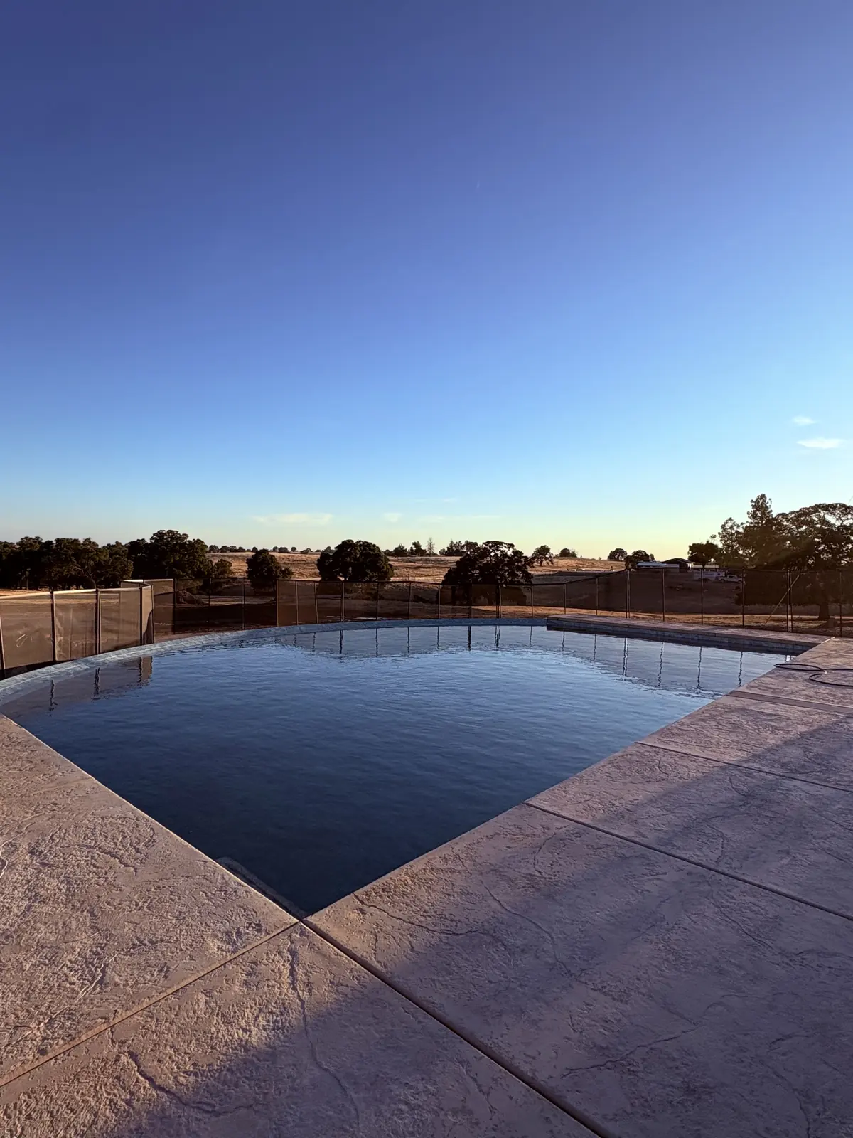 Pool Decks detail β Geometric pool dusk stamped concrete by Pinnacle Pools and Landscape, Sacramento CA