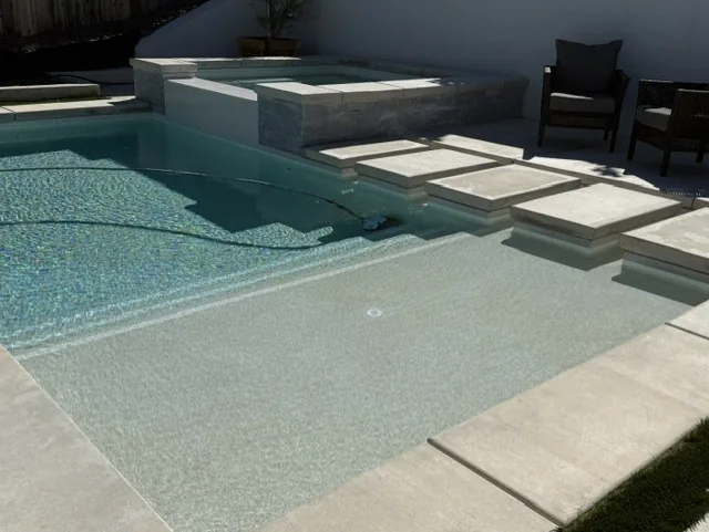 Geometric pool and spa with pebble finish by Pinnacle Pools and Landscape, Sacramento CA