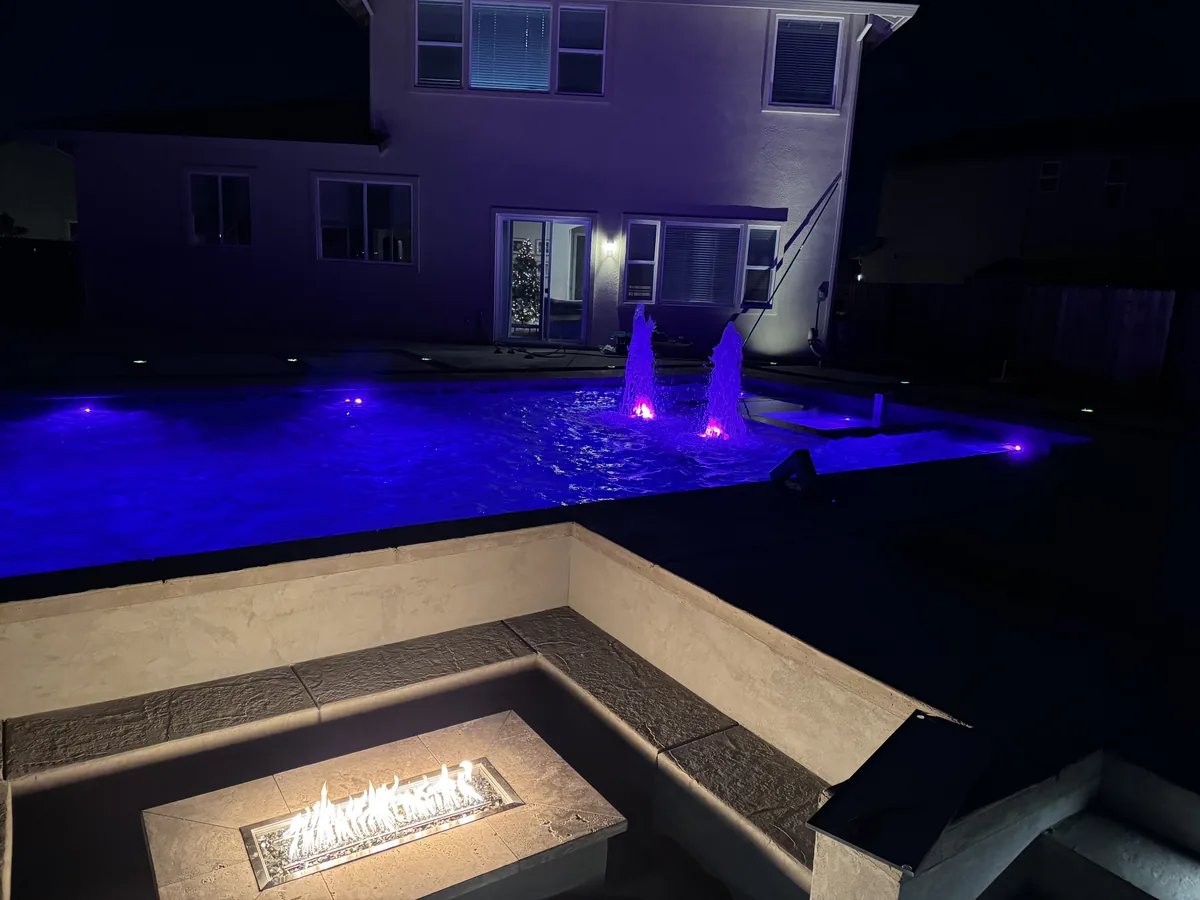 Pool fire feature blue led night by Pinnacle Pools and Landscape, Sacramento CA
