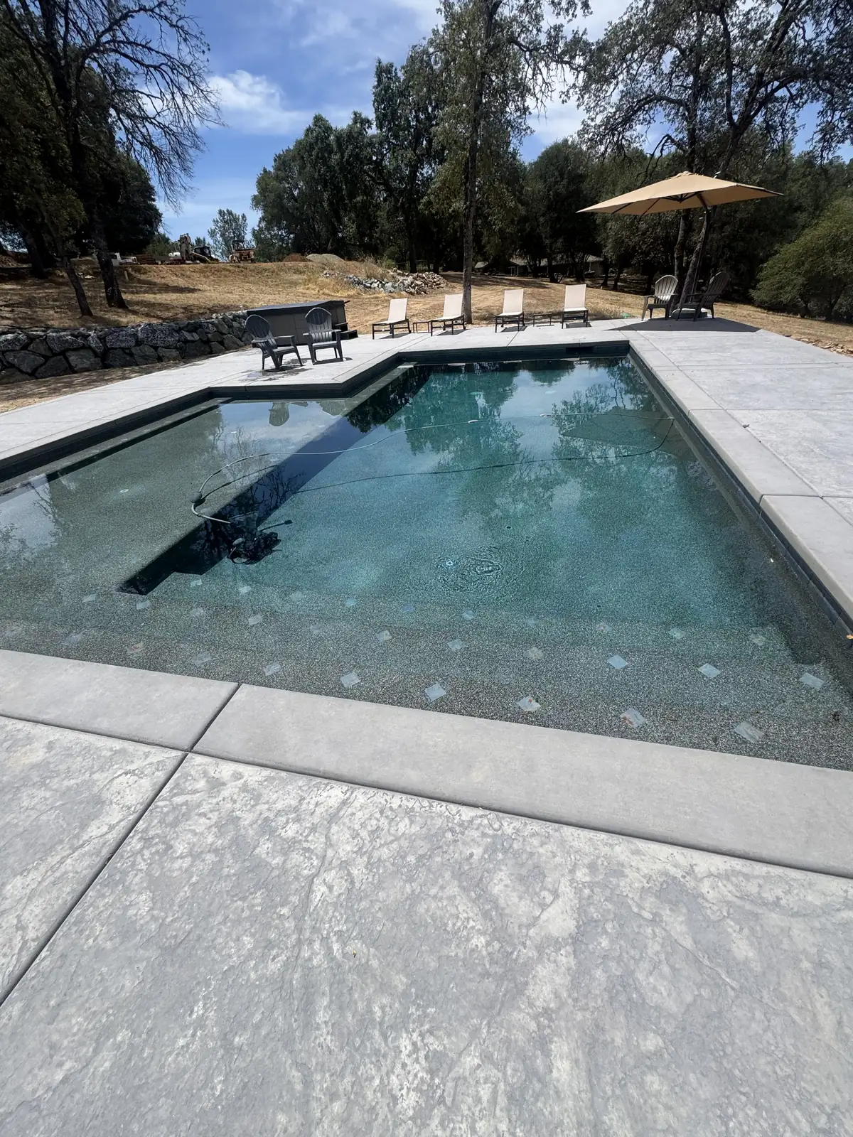 Pool hillside view lounge deck by Pinnacle Pools and Landscape, Sacramento CA