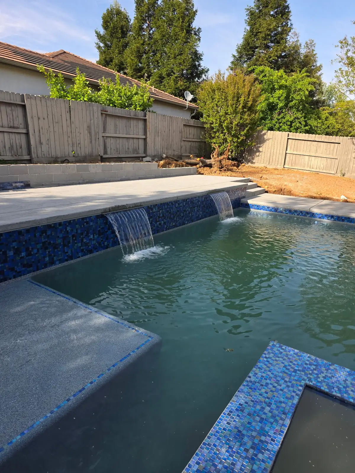 Pool sheer descent waterfall glass tile by Pinnacle Pools and Landscape, Sacramento CA