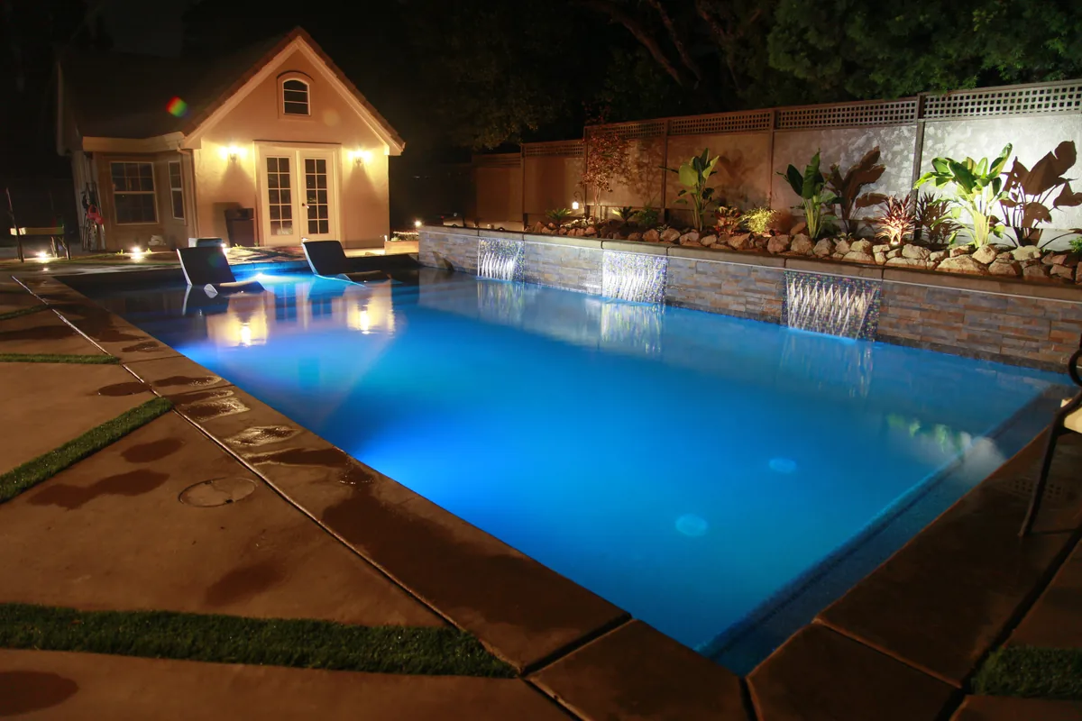 3D Pool Design detail β Rectangular pool landscape lighting night by Pinnacle Pools and Landscape, Sacramento CA