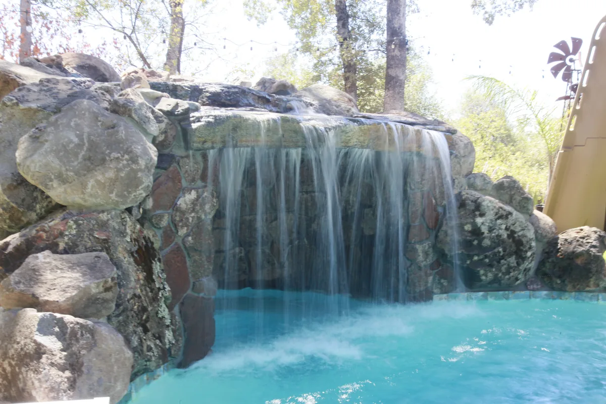 Pool Remodeling detail — Rock waterfall grotto pool by Pinnacle Pools and Landscape, Sacramento CA